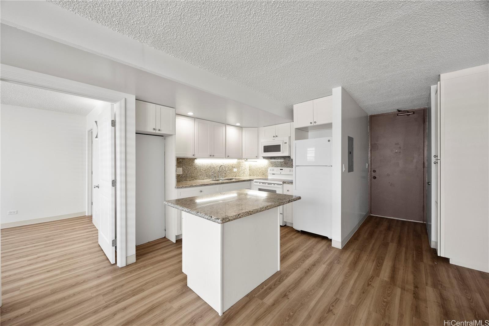 412 Launiu Street Honolulu, HI 96815 - Photo 9 of 20 a kitchen with stainless steel appliances granite countertop a refrigerator and a stove top oven