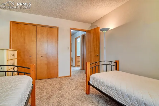 a bedroom with a bed and a table