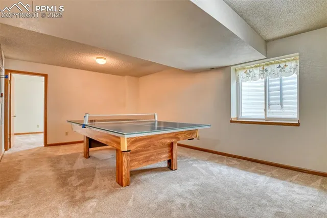 a room with wooden floor and windows