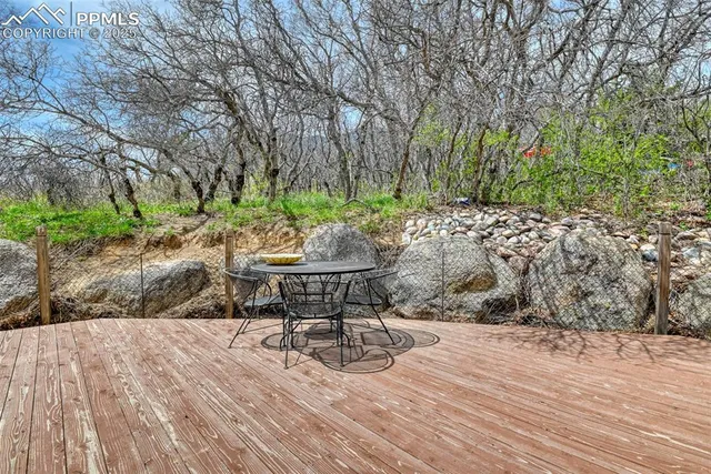 a view of a backyard with sitting area