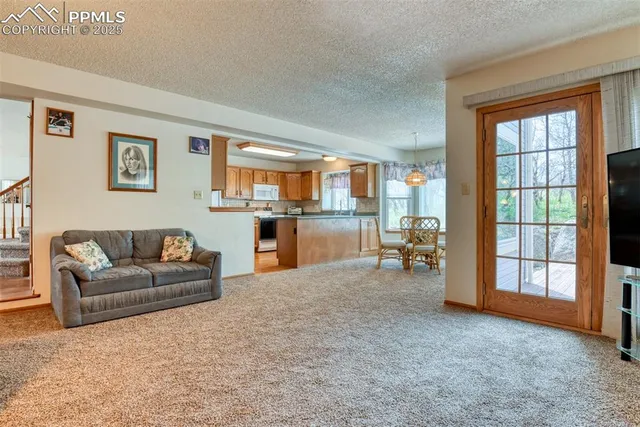 a living room with furniture and a table