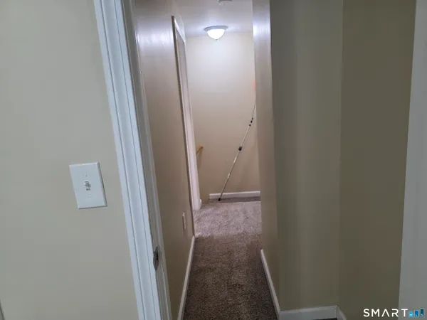 a view of hallway with a mirror