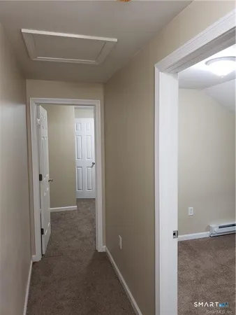 a view of a hallway with closet