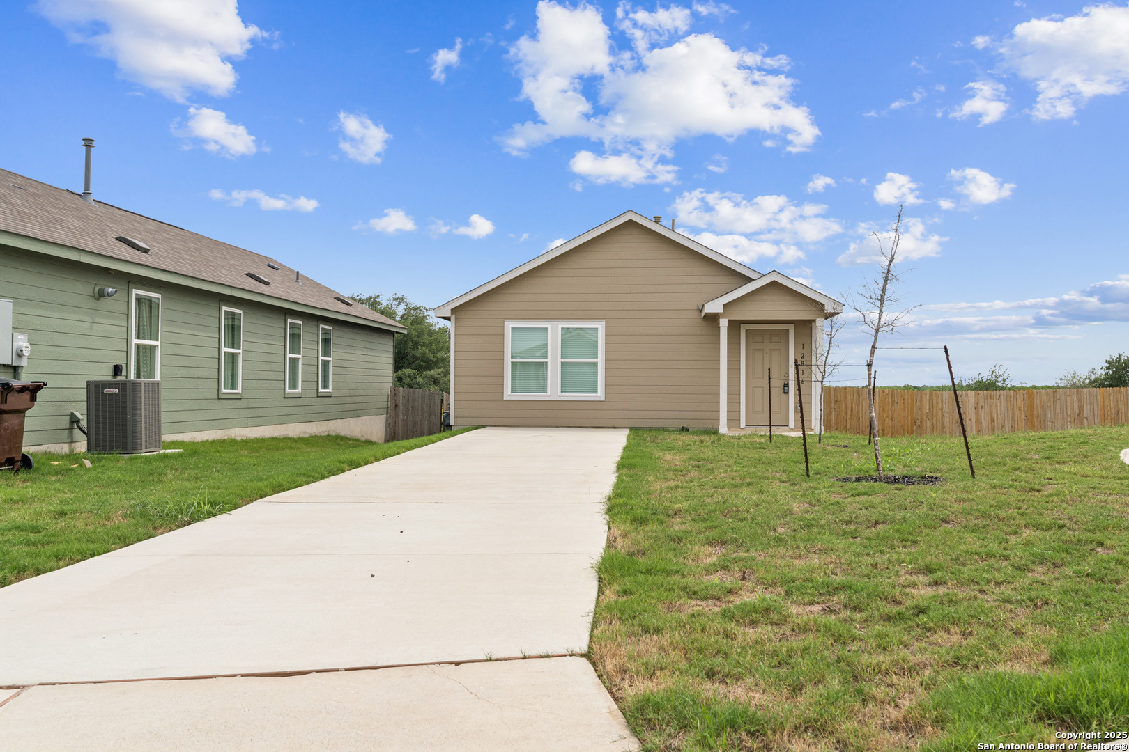 a house view with a backyard space