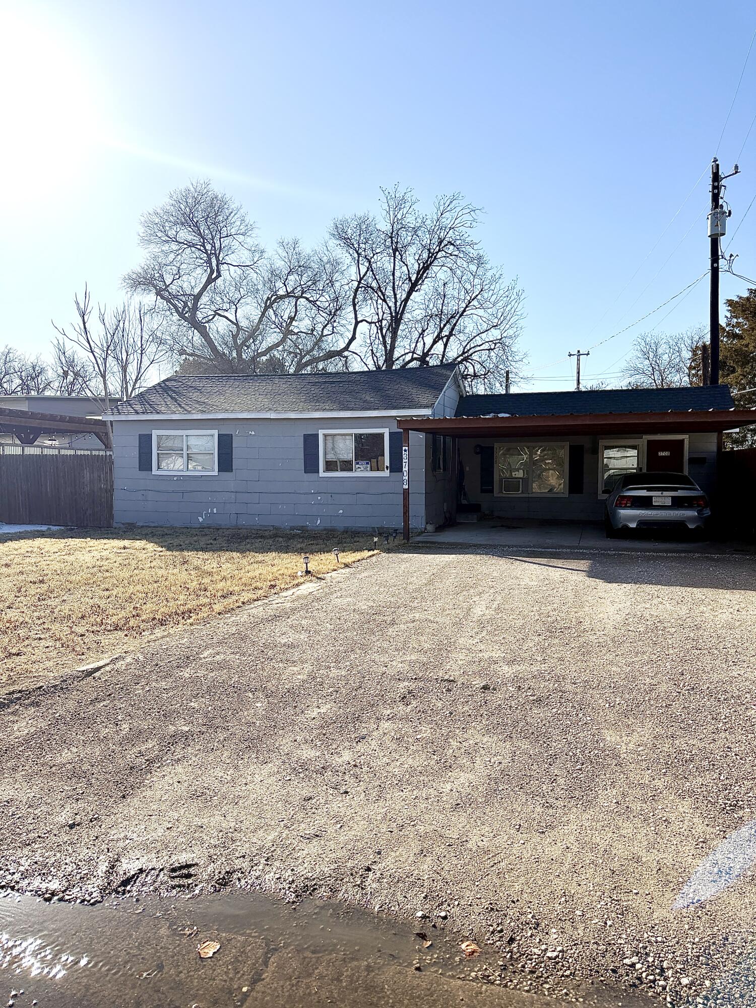 a view of a house next to a big yard