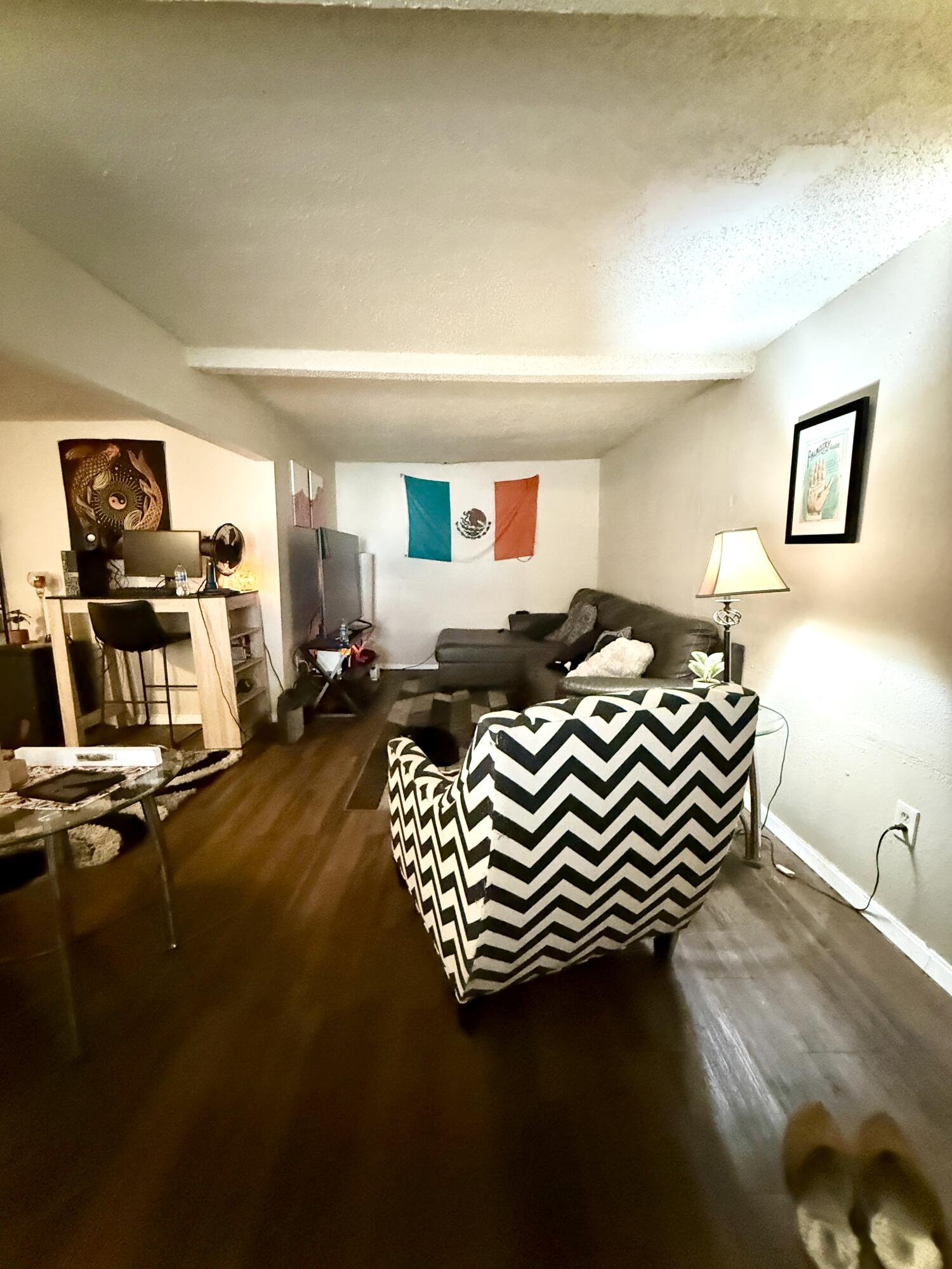 3708 Elgin Avenue Lubbock, TX 79413 - Photo 2 of 23 a bedroom with a bed and dresser