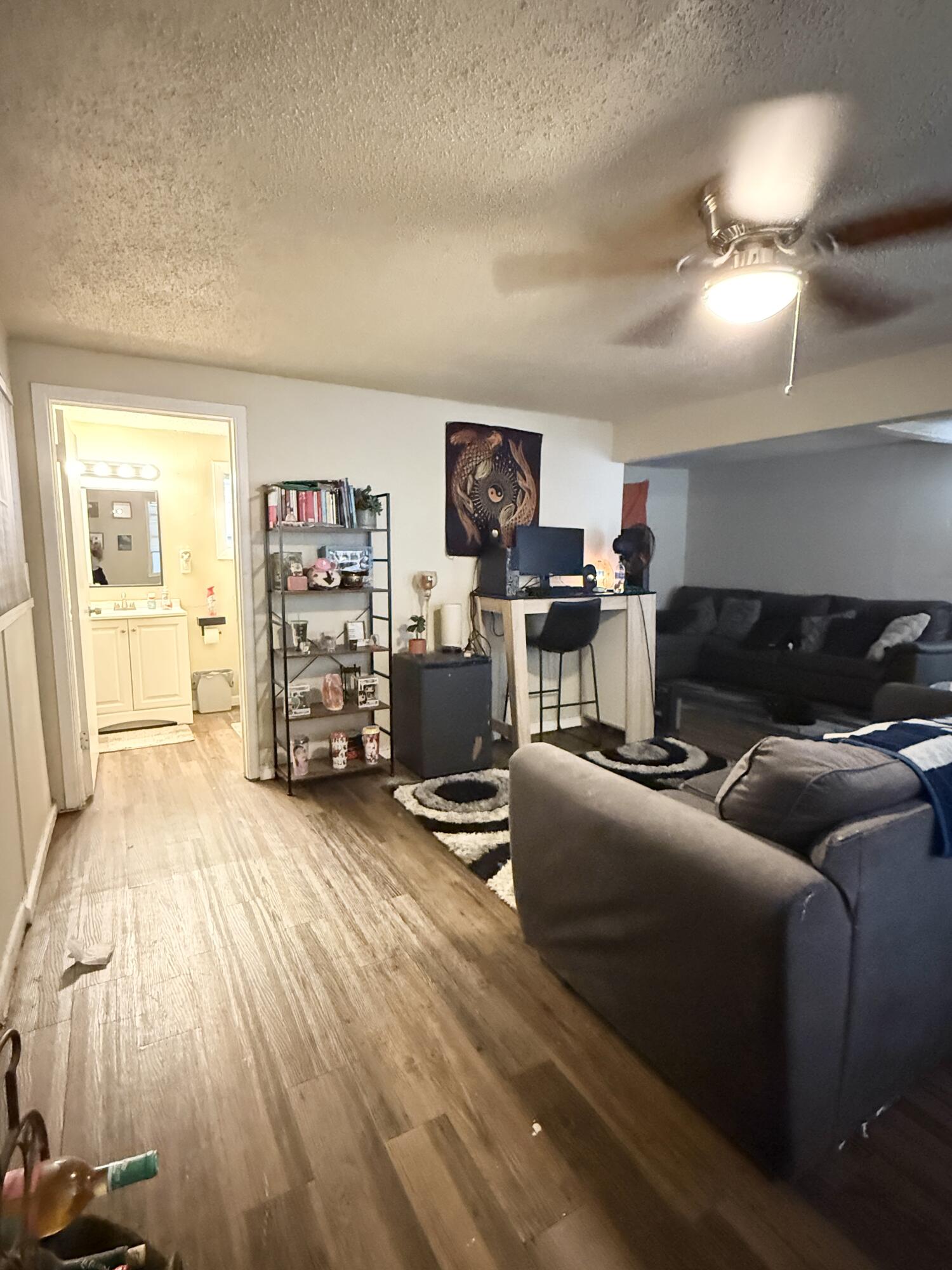 3708 Elgin Avenue Lubbock, TX 79413 - Photo 5 of 23 a living room with furniture and a wooden floor