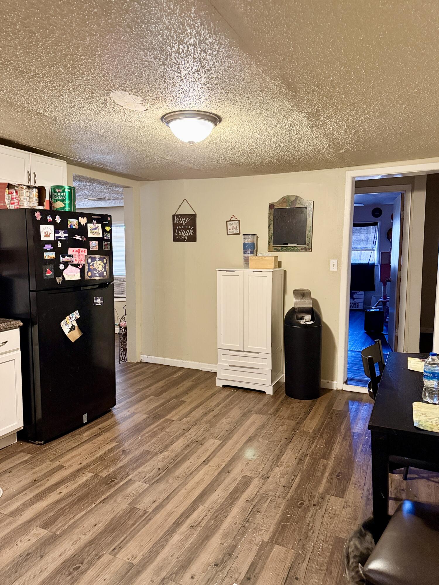 3708 Elgin Avenue Lubbock, TX 79413 - Photo 10 of 23 a bed room with a bed and a television