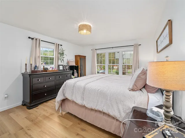 a bed room with a bed and a television