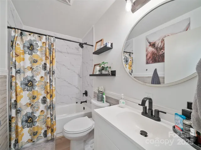 a bedroom with furniture and a bed