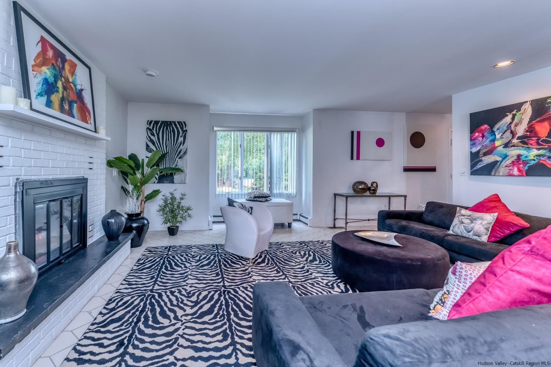 195 Arnold Drive Kingston, NY 12401 - Photo 12 of 35 a living room with furniture a couch and a bookshelf