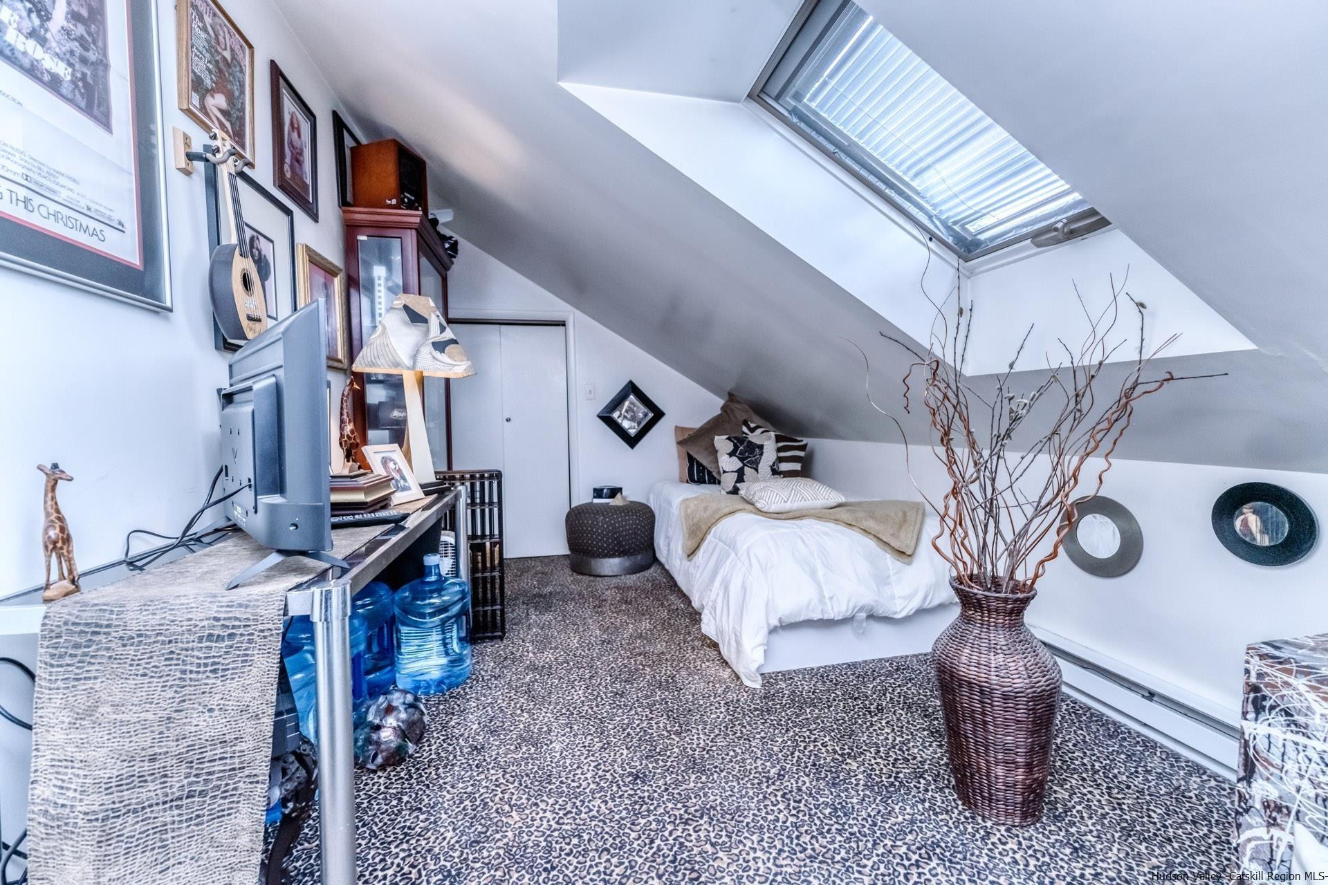 195 Arnold Drive Kingston, NY 12401 - Photo 27 of 35 a bed room with a bed and a chandelier