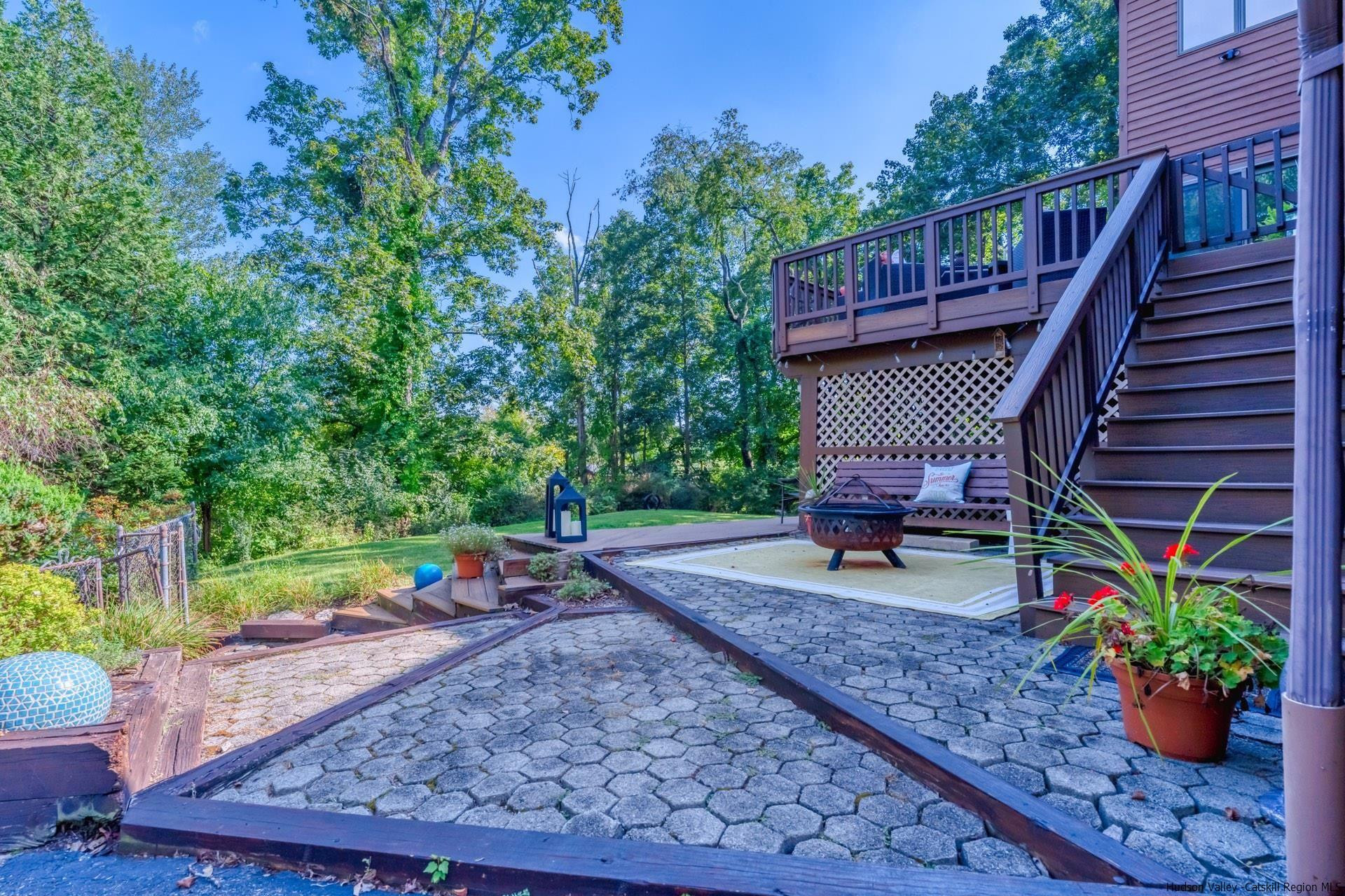 195 Arnold Drive Kingston, NY 12401 - Photo 30 of 35 a view of a chair and table in backyard of the house
