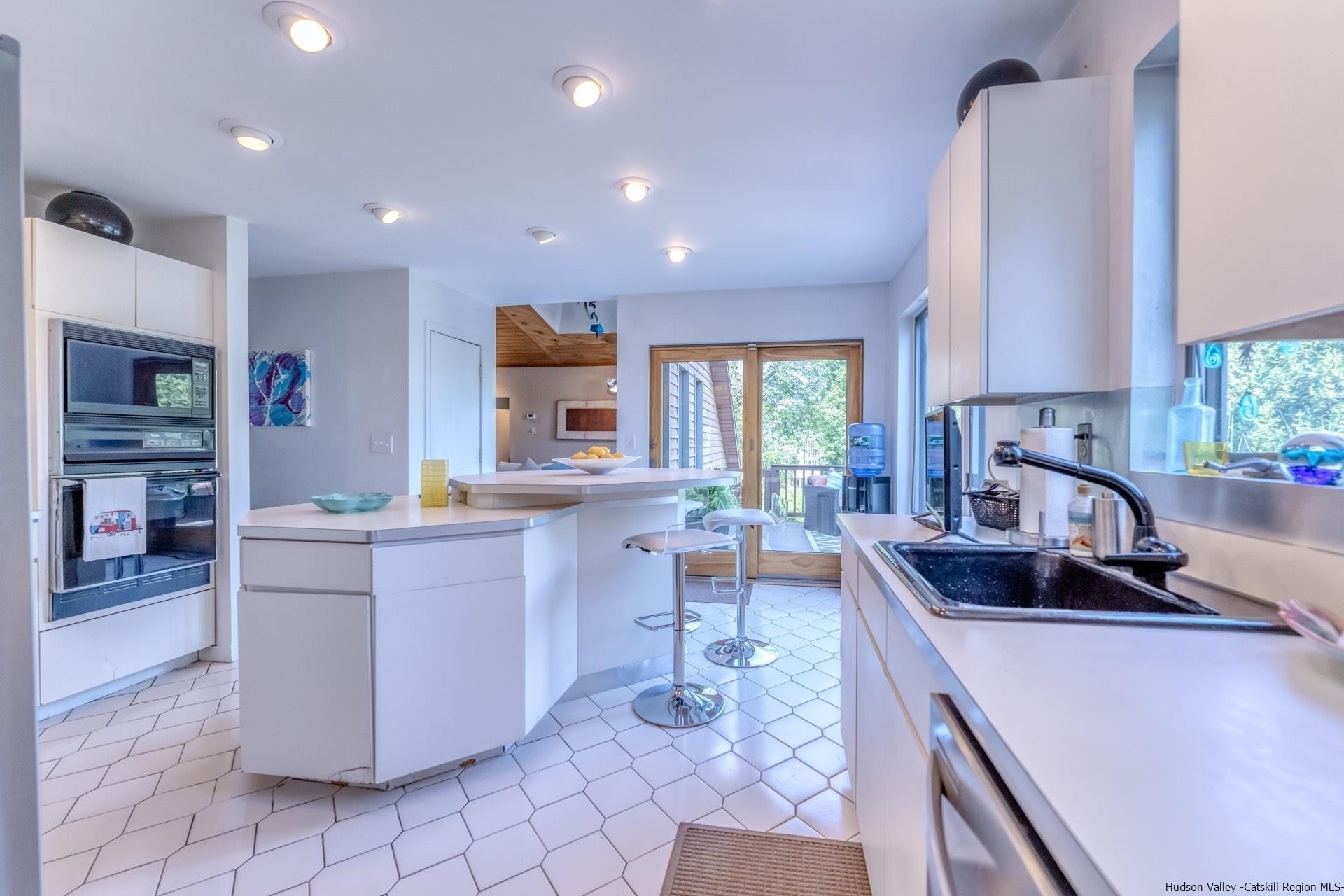 195 Arnold Drive Kingston, NY 12401 - Photo 10 of 35 a kitchen with sink cabinets and window