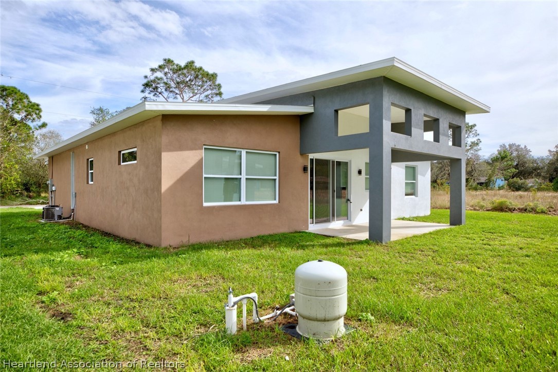 2545 Odessa Road Avon Park, FL 33825 - Photo 24 of 24 a front view of a house with a yard and porch