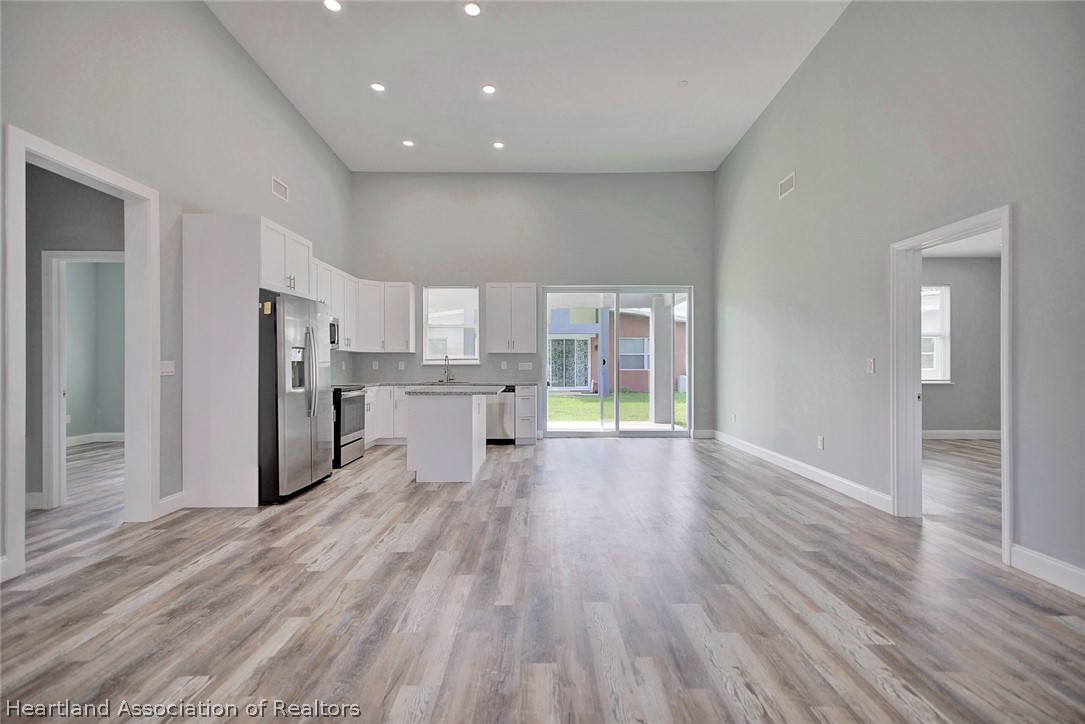 2545 Odessa Road Avon Park, FL 33825 - Photo 4 of 24 a view of kitchen with wooden floor