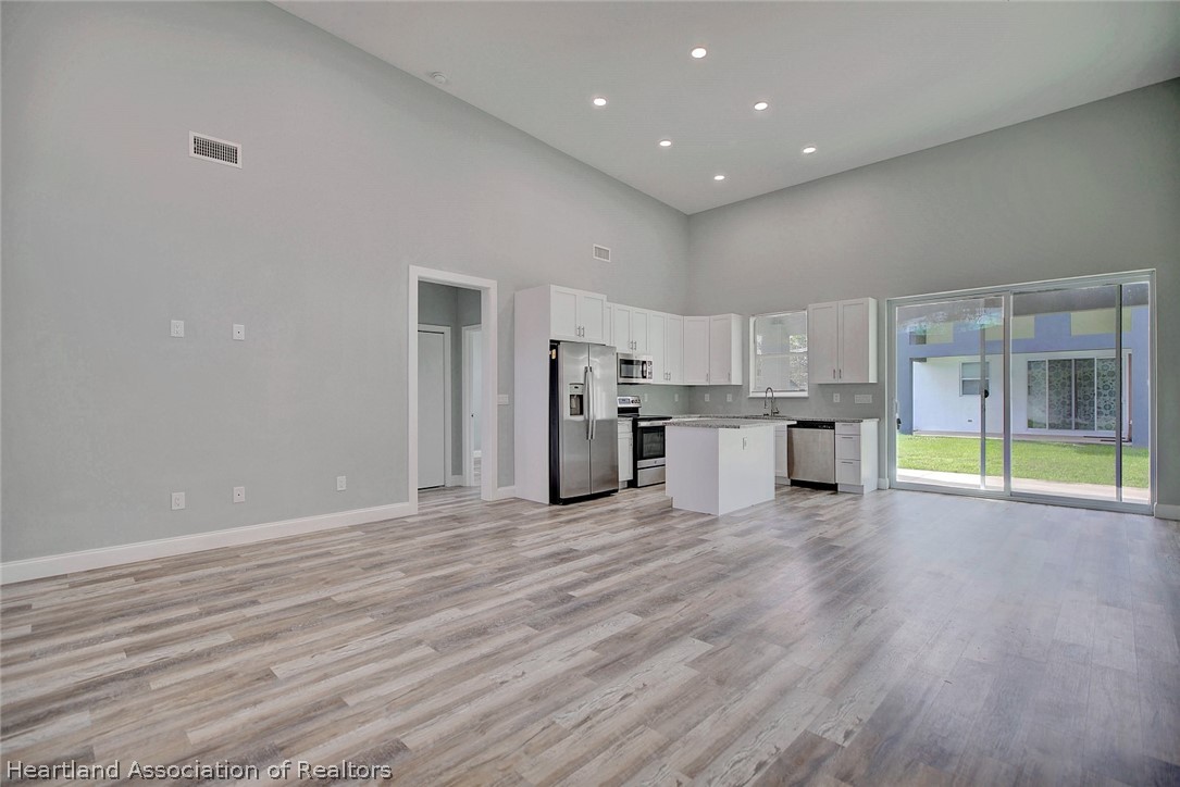 2545 Odessa Road Avon Park, FL 33825 - Photo 5 of 24 a view of a kitchen with a sink and a refrigerator