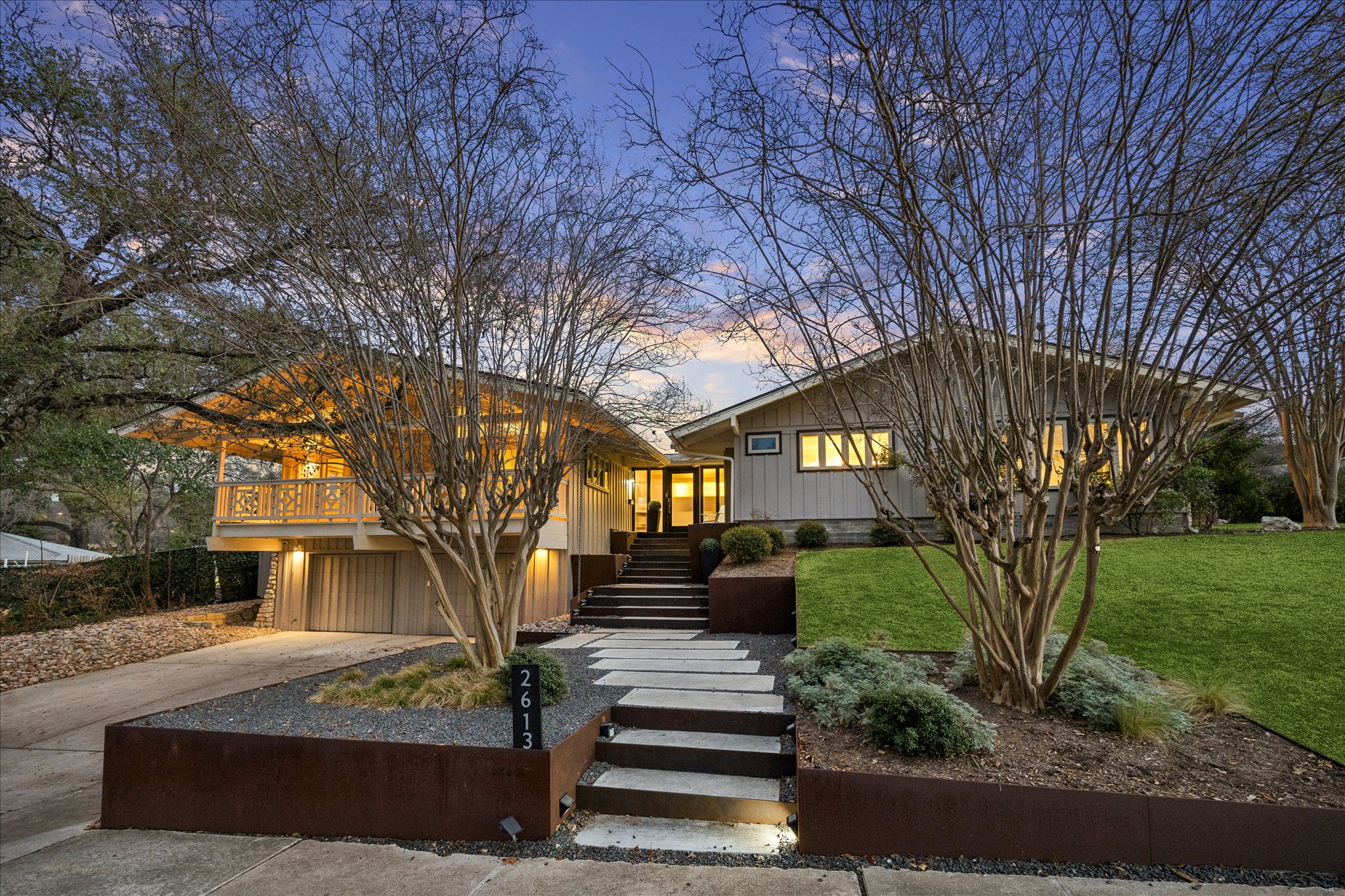 2613 Spring Lane Austin, TX 78703 - Photo 2 of 32 a front view of a house with garden