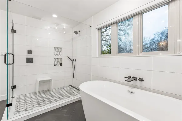 a spacious bathroom with a double vanity sink mirror and