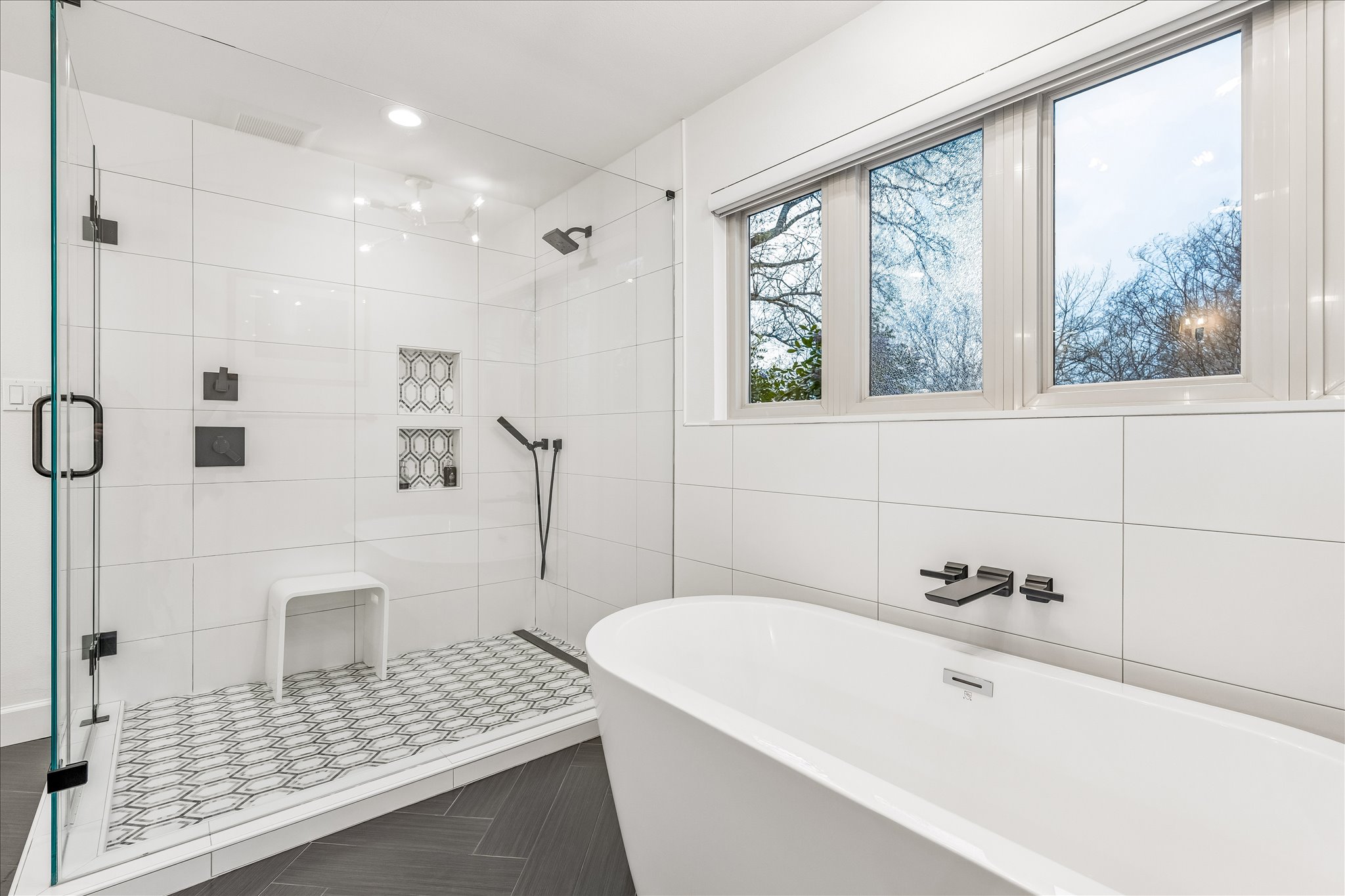 2613 Spring Lane Austin, TX 78703 - Photo 21 of 32 a bathroom with a bathtub and a shower