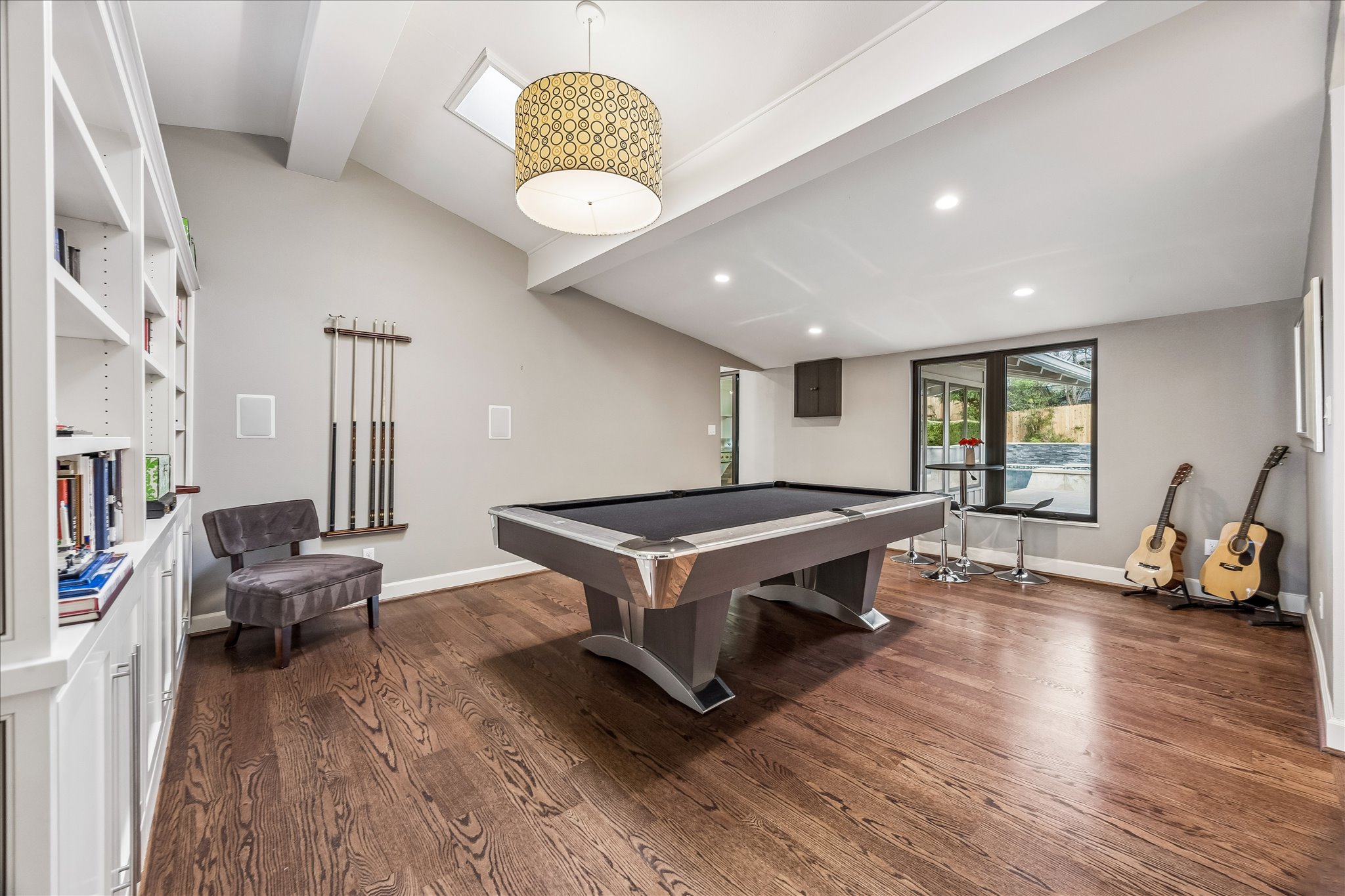 2613 Spring Lane Austin, TX 78703 - Photo 23 of 32 a living room with furniture a wooden floor and a large window