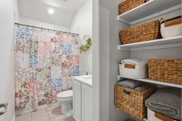 a room with gym equipment on the wall and a window