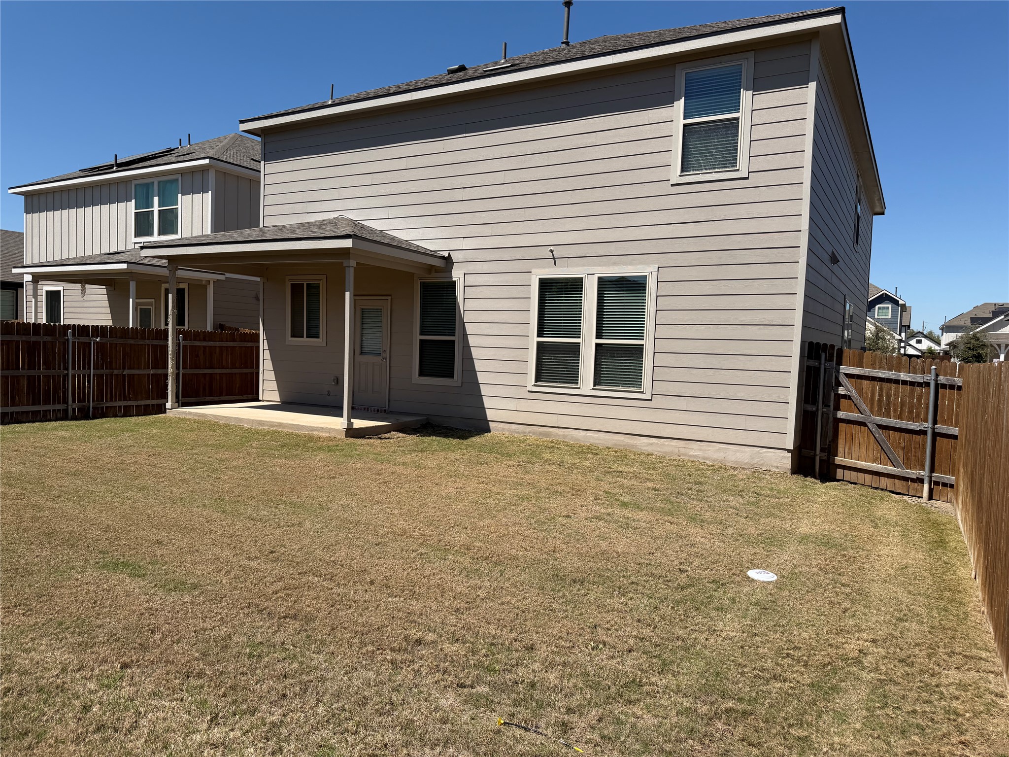 316 Harper Lane Georgetown, TX 78626 - Photo 21 of 21 Back of property featuring a covered patio area and a fenced backyard