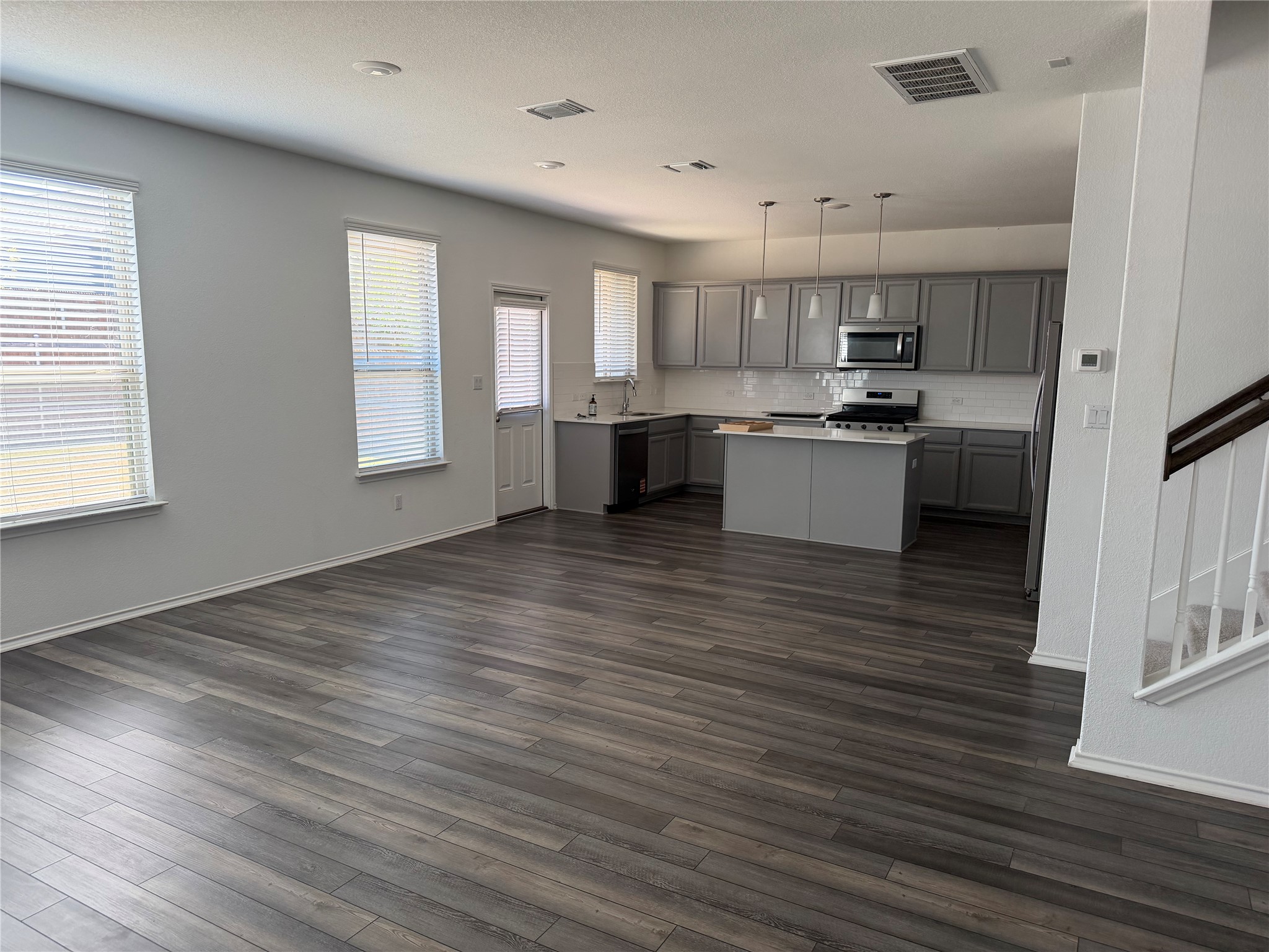 316 Harper Lane Georgetown, TX 78626 - Photo 3 of 21 Kitchen with a breakfast bar is open to the dining area an living area