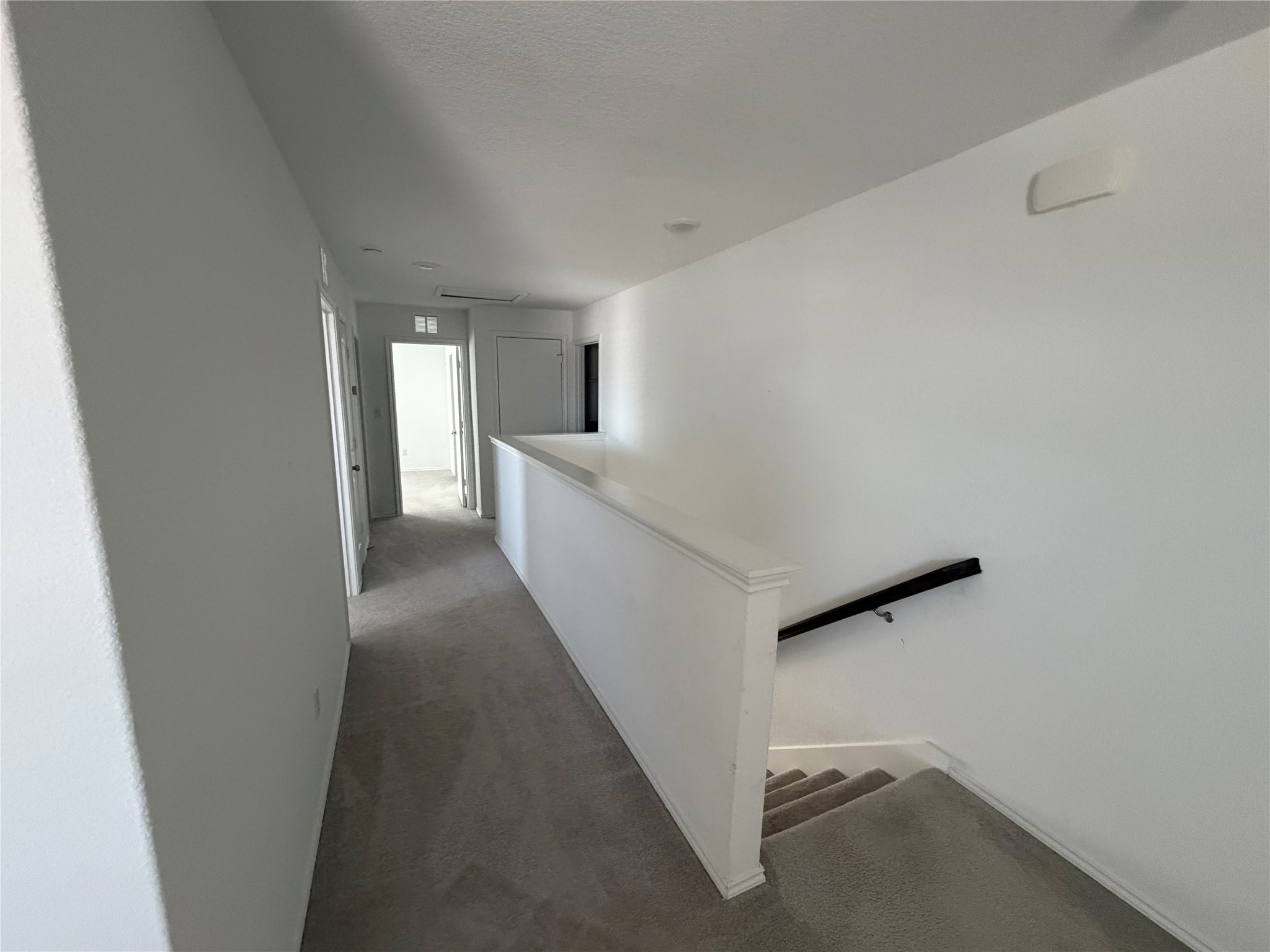 316 Harper Lane Georgetown, TX 78626 - Photo 6 of 21 Upstairs hallway with dark colored carpet