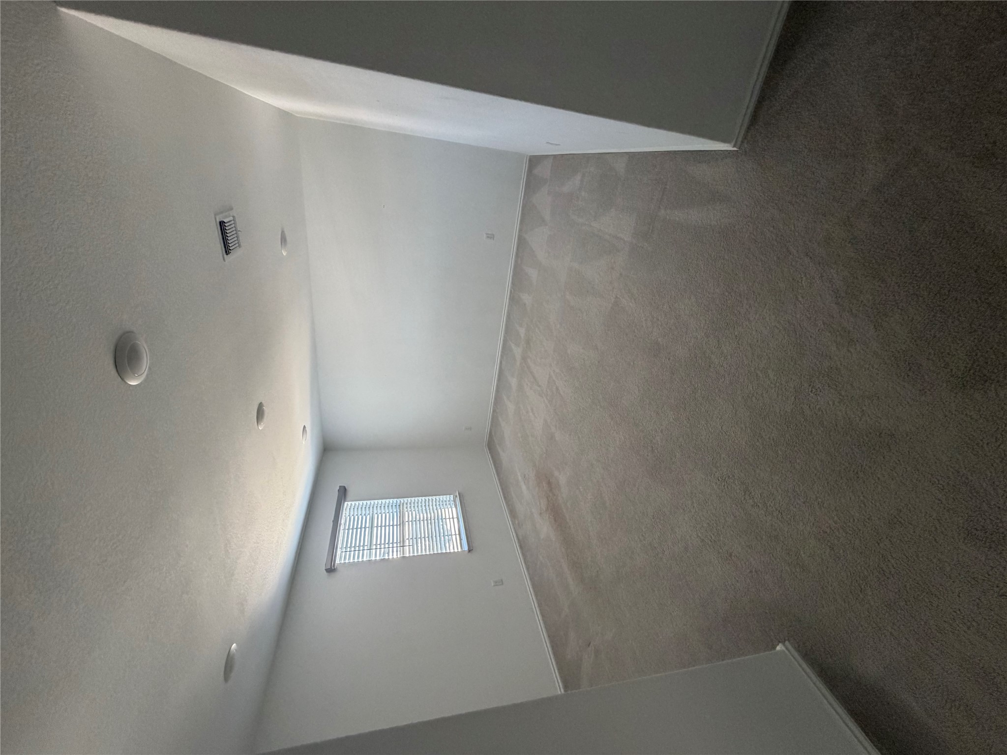 316 Harper Lane Georgetown, TX 78626 - Photo 7 of 21 Unfurnished room with dark carpet and a textured ceiling