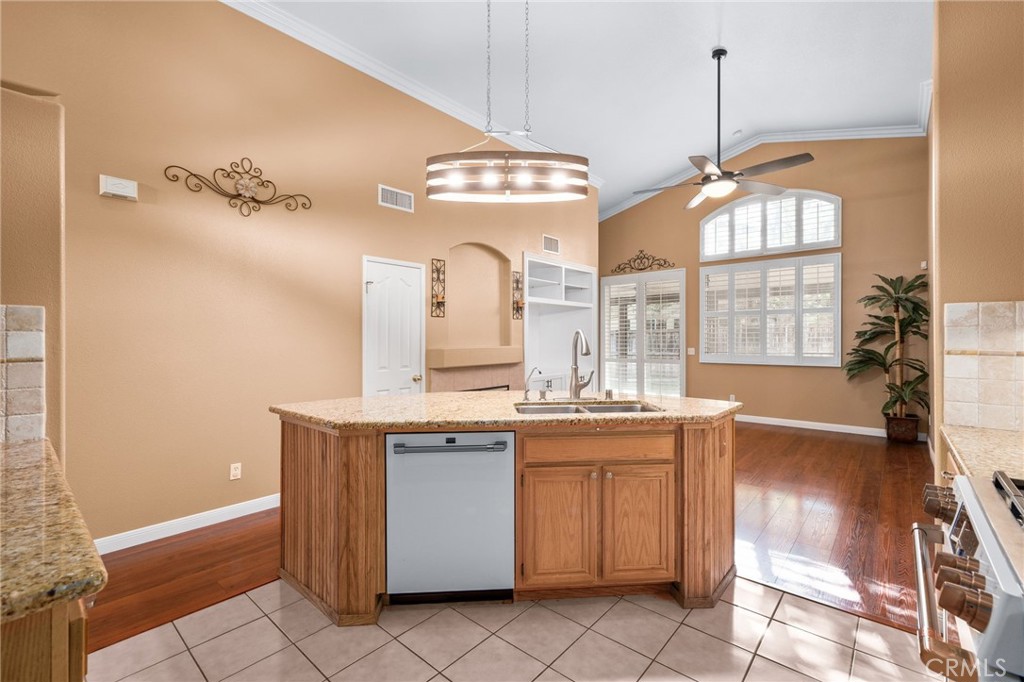 9403 Old Post Drive Rancho Cucamonga, CA 91730 - Photo 12 of 38 a view of a kitchen with a sink and chandelier