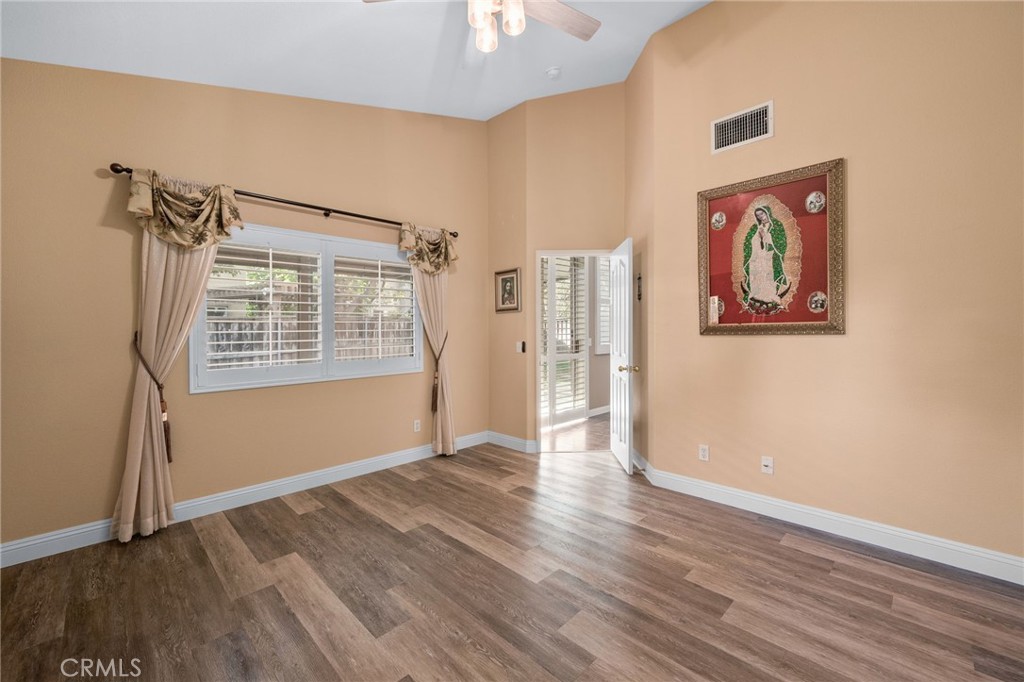 9403 Old Post Drive Rancho Cucamonga, CA 91730 - Photo 20 of 38 an empty room with wooden floor closet and windows
