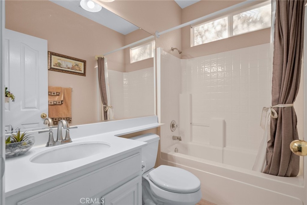 9403 Old Post Drive Rancho Cucamonga, CA 91730 - Photo 26 of 38 a bathroom with a sink a toilet and shower