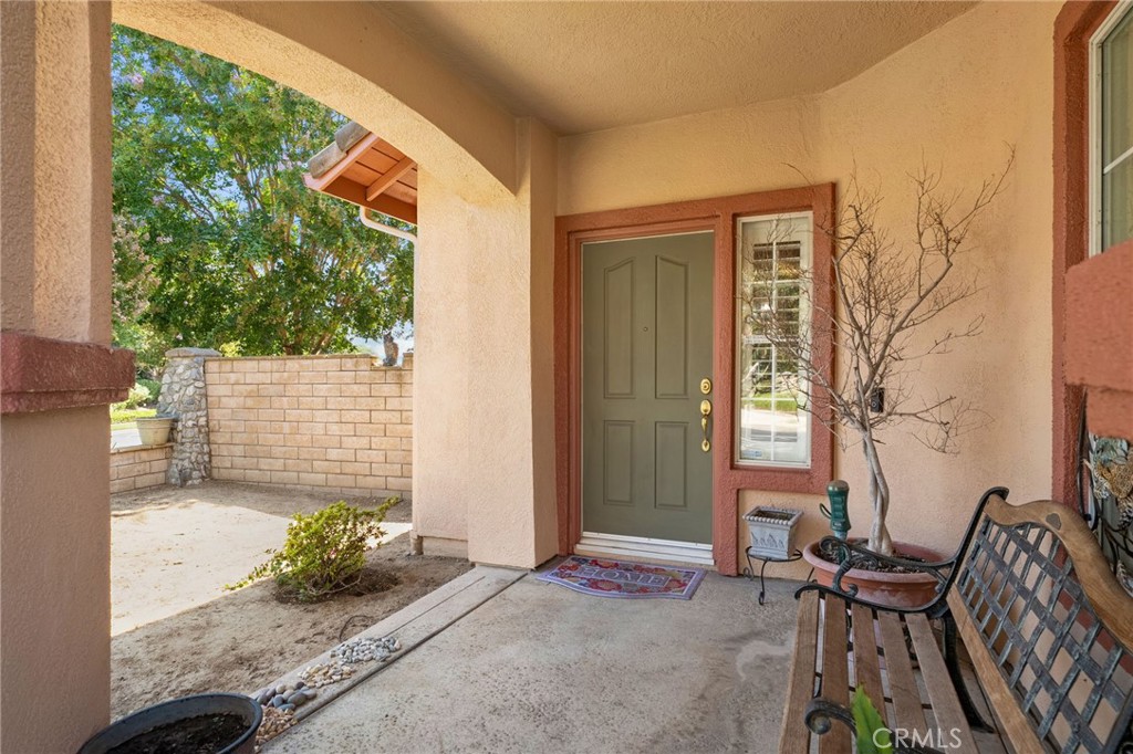 9403 Old Post Drive Rancho Cucamonga, CA 91730 - Photo 3 of 38 a balcony with table and chairs and potted plants