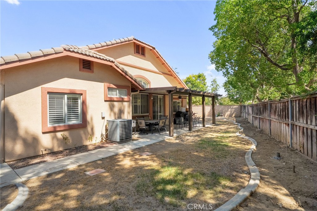 9403 Old Post Drive Rancho Cucamonga, CA 91730 - Photo 34 of 38 a backyard of a house with table and chairs