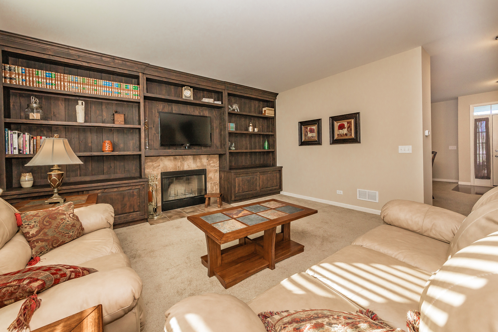 183 Reston Lane Gilberts, IL 60136 - Photo 8 of 26 a living room with furniture or couch and a fireplace