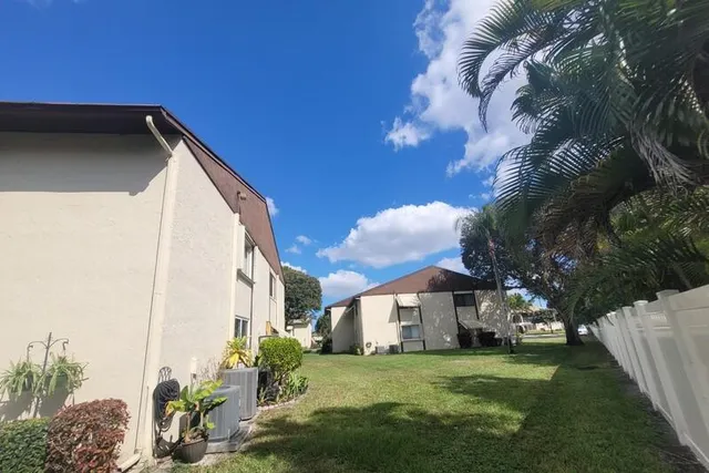 a view of a park with swings and slides