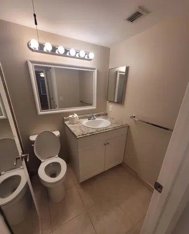 a view of a patio with a table and chairs