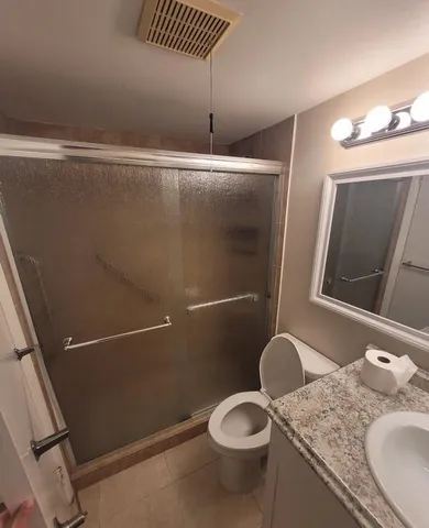 a view of a house with a yard and a garden