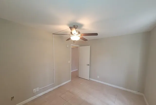 an aerial view of a house with garden space and street view