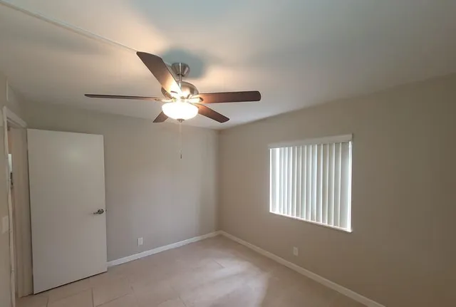 an aerial view of multiple houses with yard
