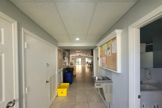 an aerial view of a house with yard swimming pool and outdoor seating