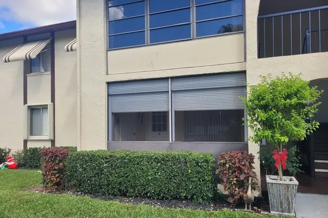 a kitchen with stainless steel appliances granite countertop a refrigerator stove and microwave