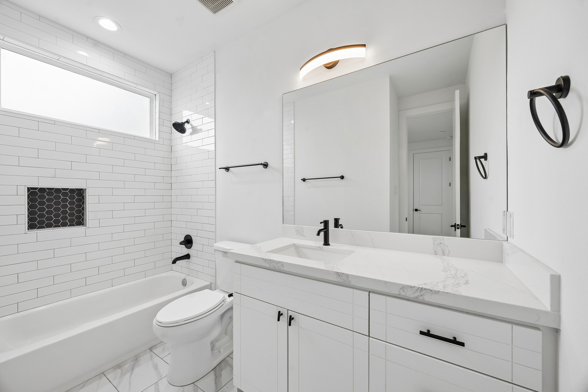 424 Sikes Street Houston, TX 77018 - Photo 10 of 12 a bathroom with a sink a toilet and shower