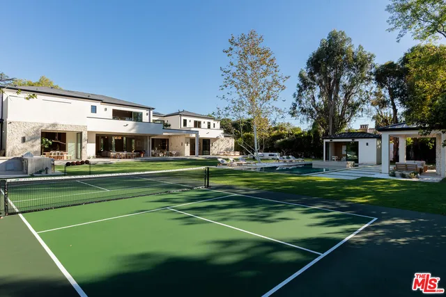 a front view of a house with a big yard