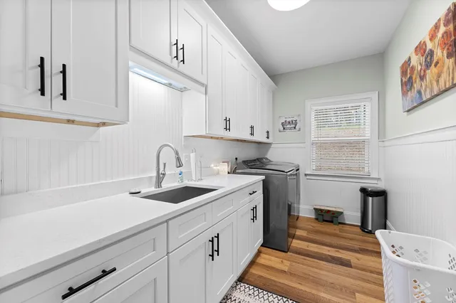 a kitchen with a sink and cabinets