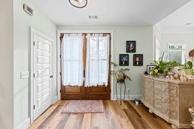 a view of entryway with wooden floor