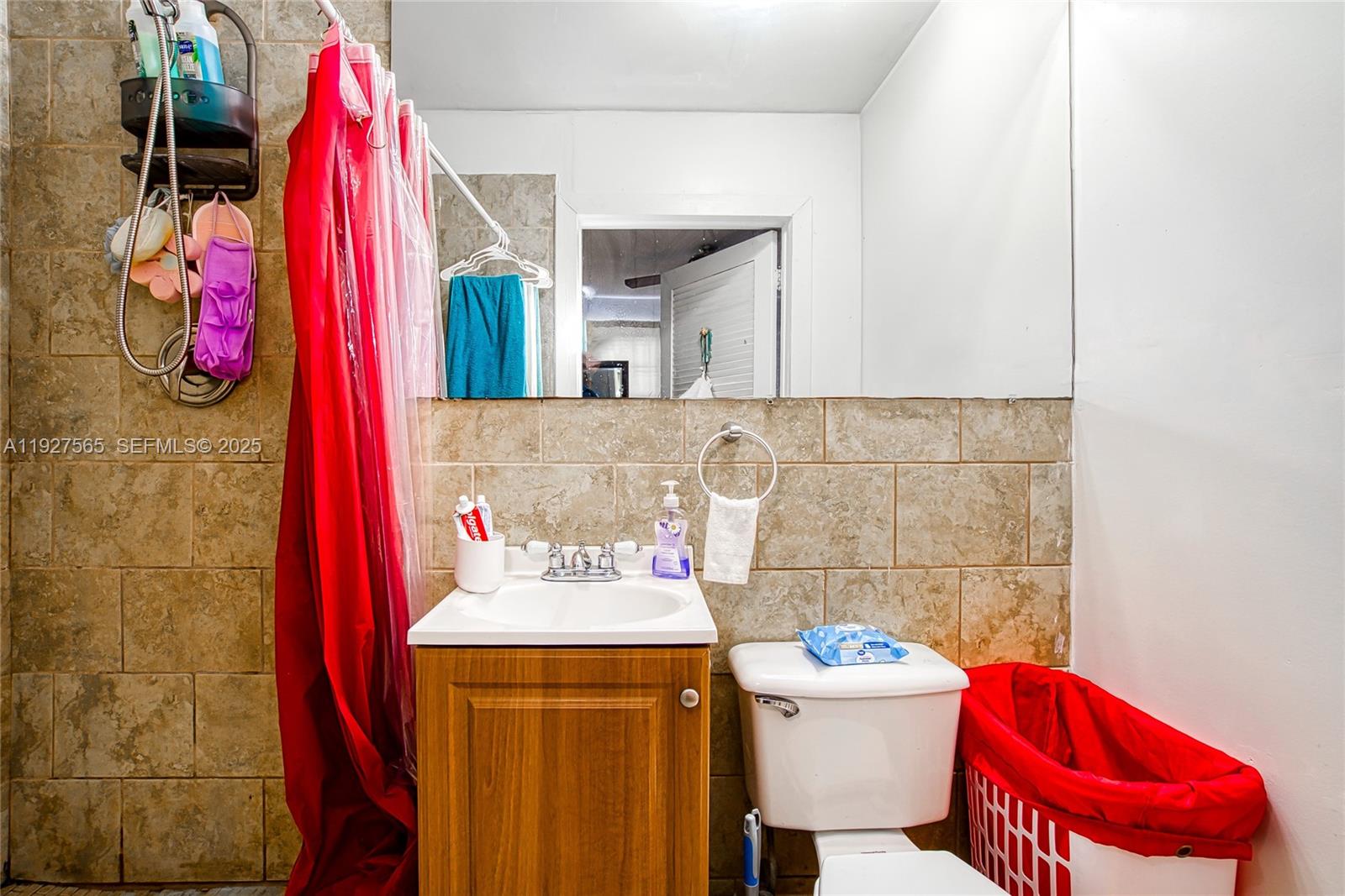 2516 Cleveland Street Hollywood, FL 33020 - Photo 14 of 42 a bathroom with a sink and a mirror