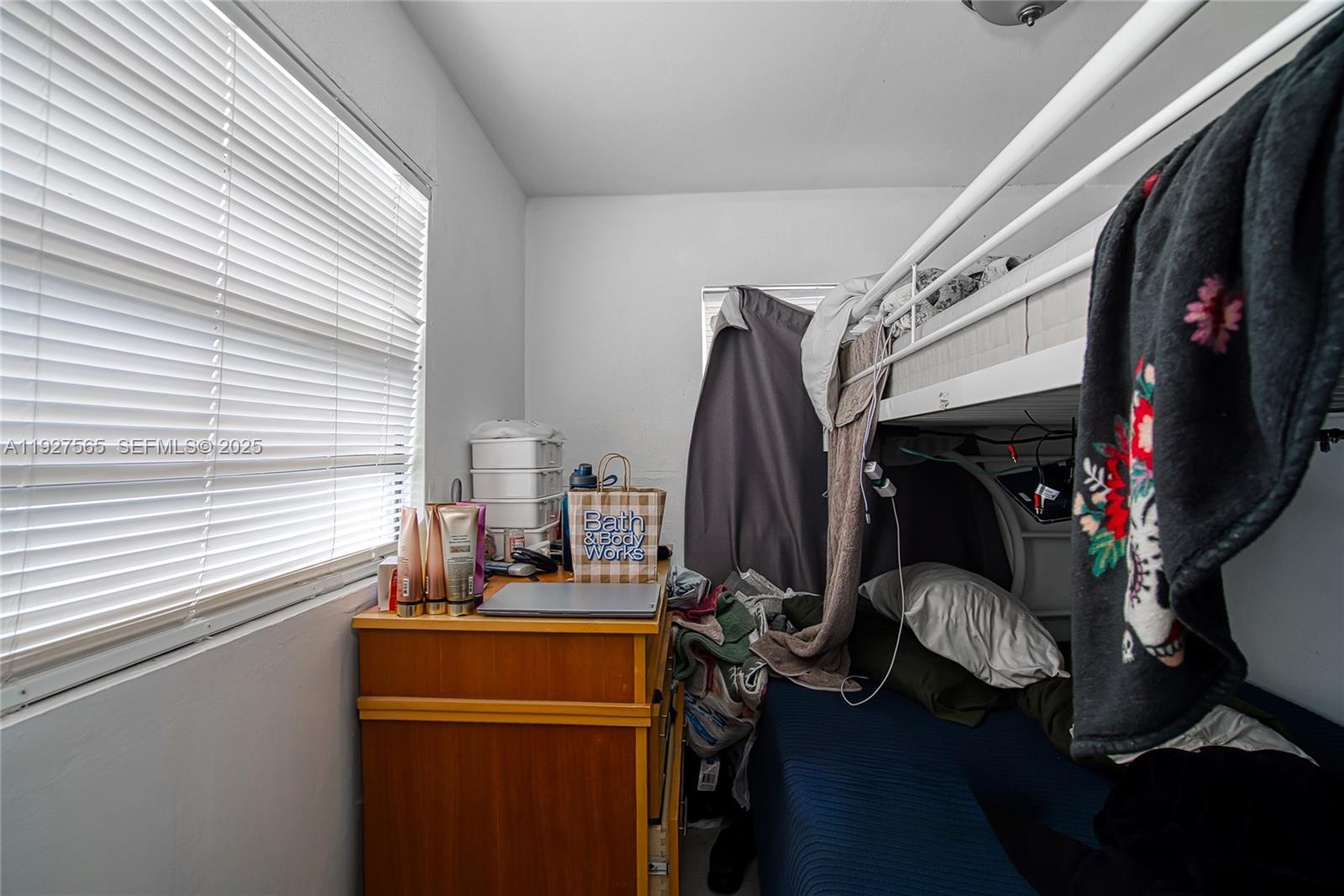 2516 Cleveland Street Hollywood, FL 33020 - Photo 19 of 42 a view of walk in closet with clothes and shoes
