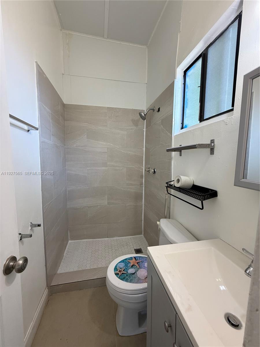 2516 Cleveland Street Hollywood, FL 33020 - Photo 33 of 42 a bathroom with a sink a toilet and shower